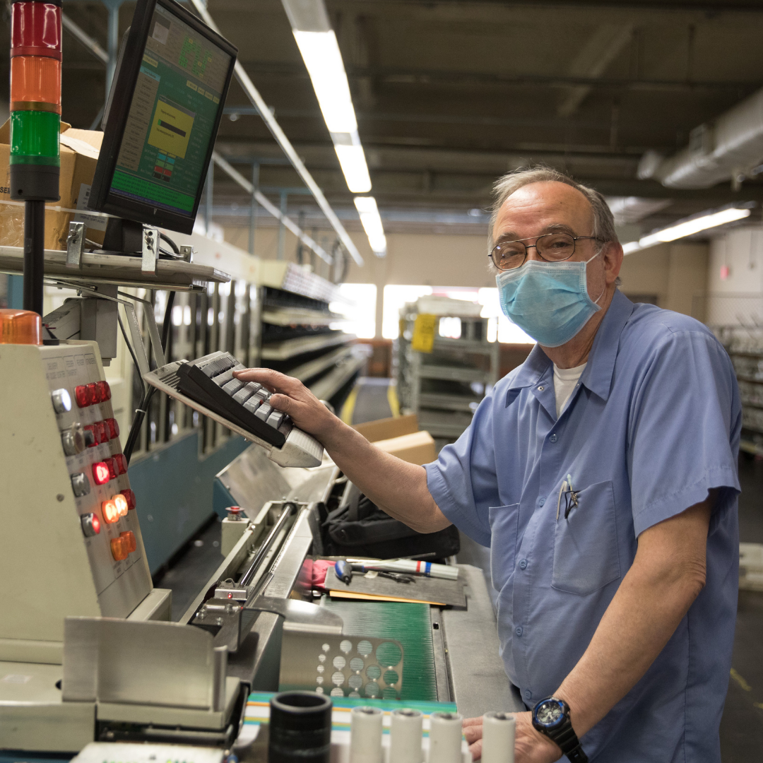 Man wearing a mask in a factory